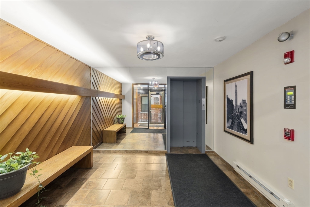 328 Commercial Street, Unit 53 Boston, MA 02109 - Photo 9 of 14 workspace with wooden floor and windows