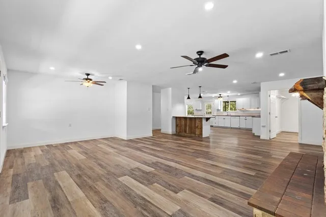 a view of kitchen and kitchen with a hallway