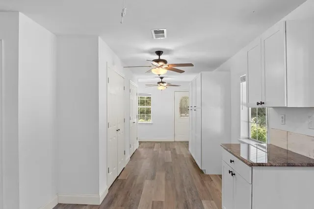 a view of a hallway with a chandelier