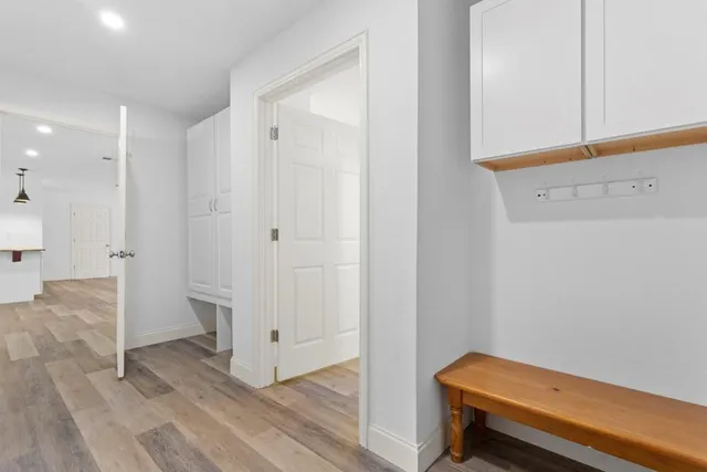 a view of room with wooden floor