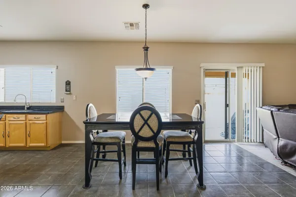 a dining room with furniture and window
