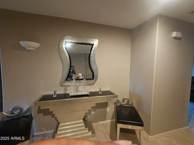 a bathroom with a sink and mirror