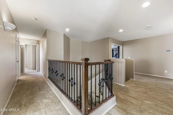 a bedroom with furniture and a flat screen tv