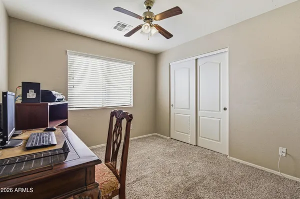 a room with pool table and windows