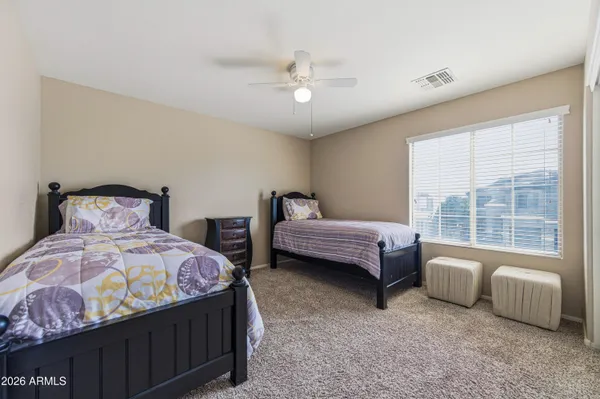 a view of a house with a swimming pool and a yard