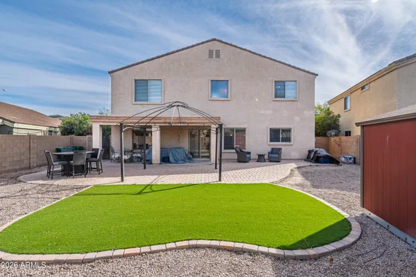 aerial view of residential houses with outdoor space and parking