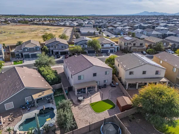 a room with water heater and wooden racks