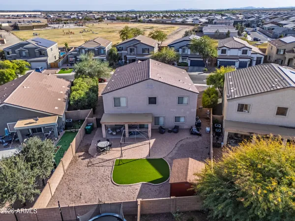 a view of a wooden door with a clock on wall