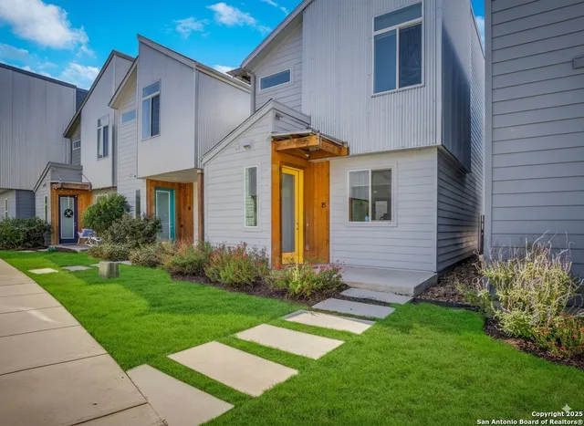 a front view of a house with garden