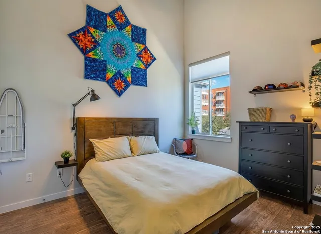 a bedroom with a bed and a window