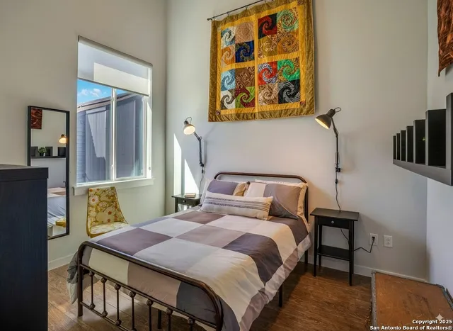 a bedroom with a bed and dresser