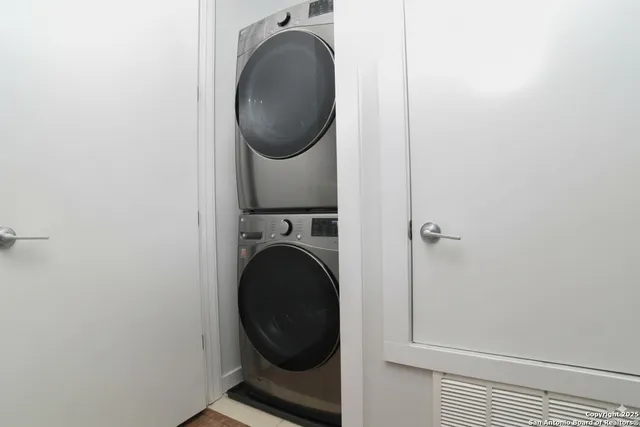 a close view of a utility room with dryer and washer