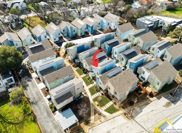 an aerial view of a city with lots of residential buildings