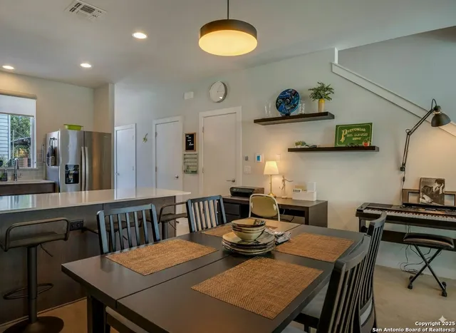 a view of a dining room with furniture