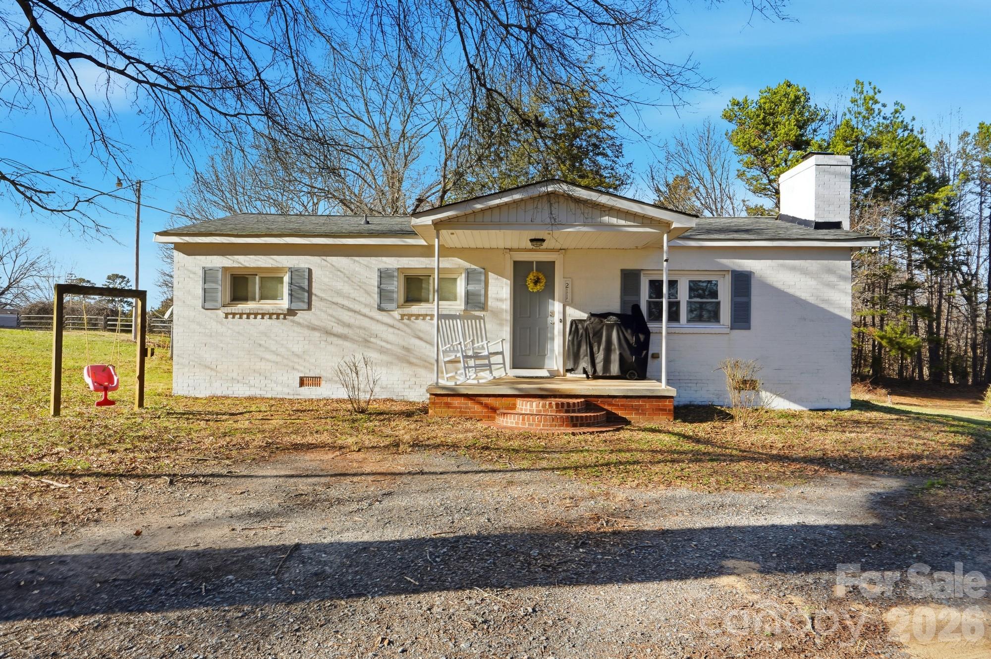 211 Ratchford Farm Road Gastonia, NC 28056 - Photo 1 of 24 a front view of a house with street
