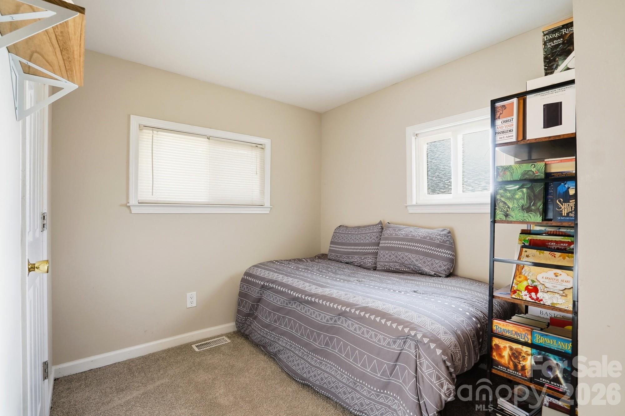 211 Ratchford Farm Road Gastonia, NC 28056 - Photo 14 of 24 a bedroom with a bed and a window