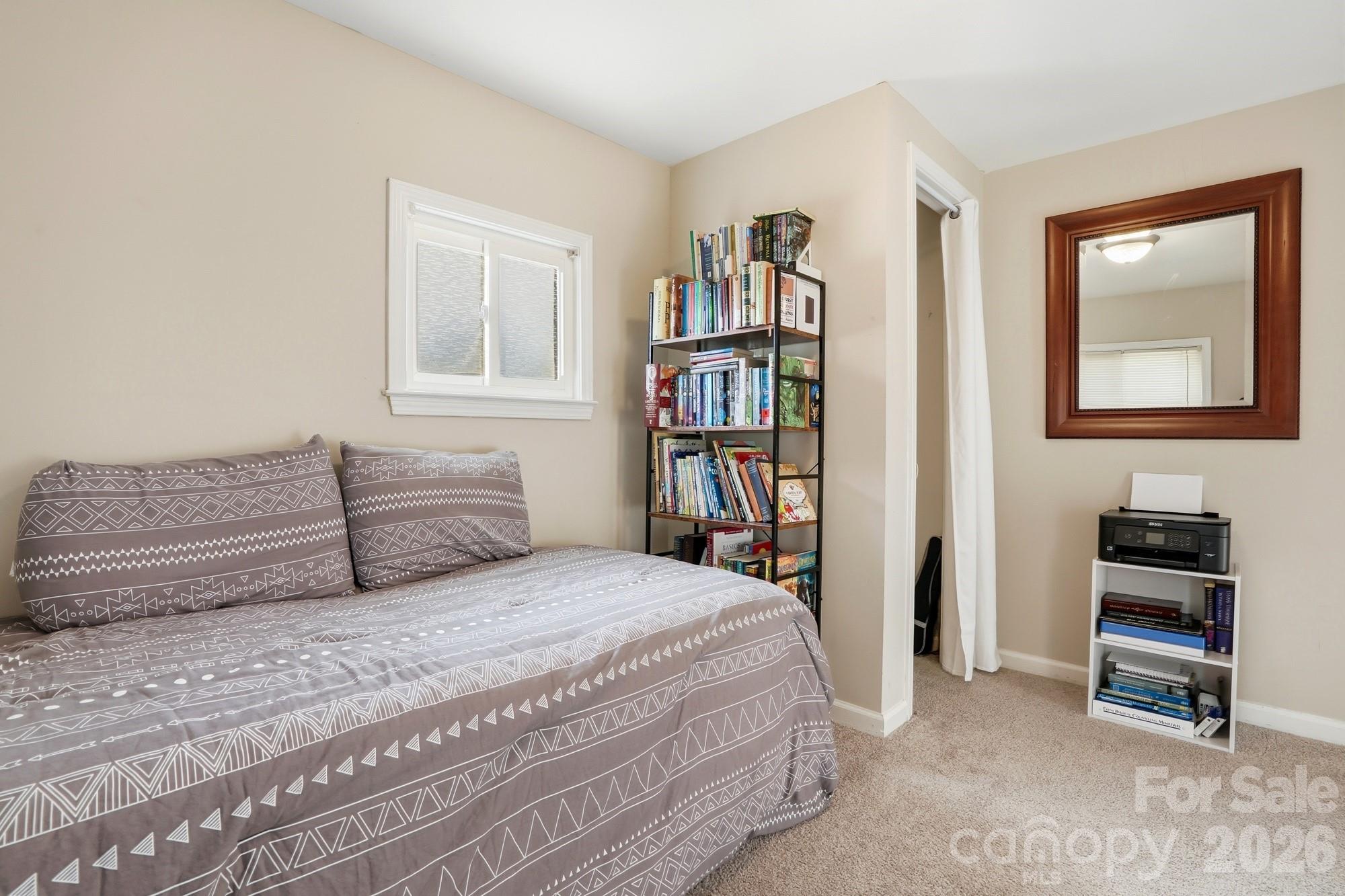 211 Ratchford Farm Road Gastonia, NC 28056 - Photo 15 of 24 a bedroom with a bed and a book shelf