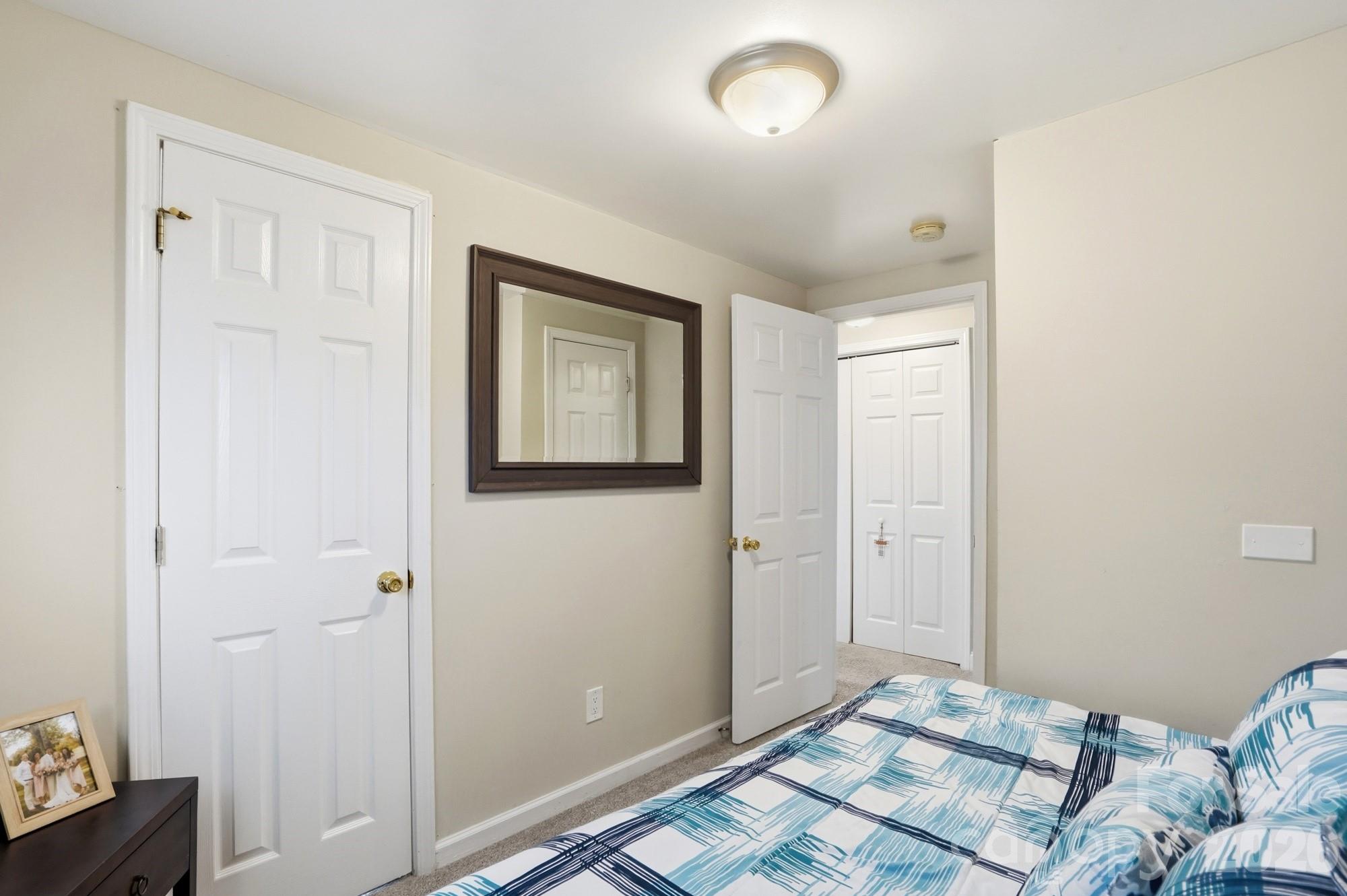 211 Ratchford Farm Road Gastonia, NC 28056 - Photo 17 of 24 a bedroom with a bed and a window