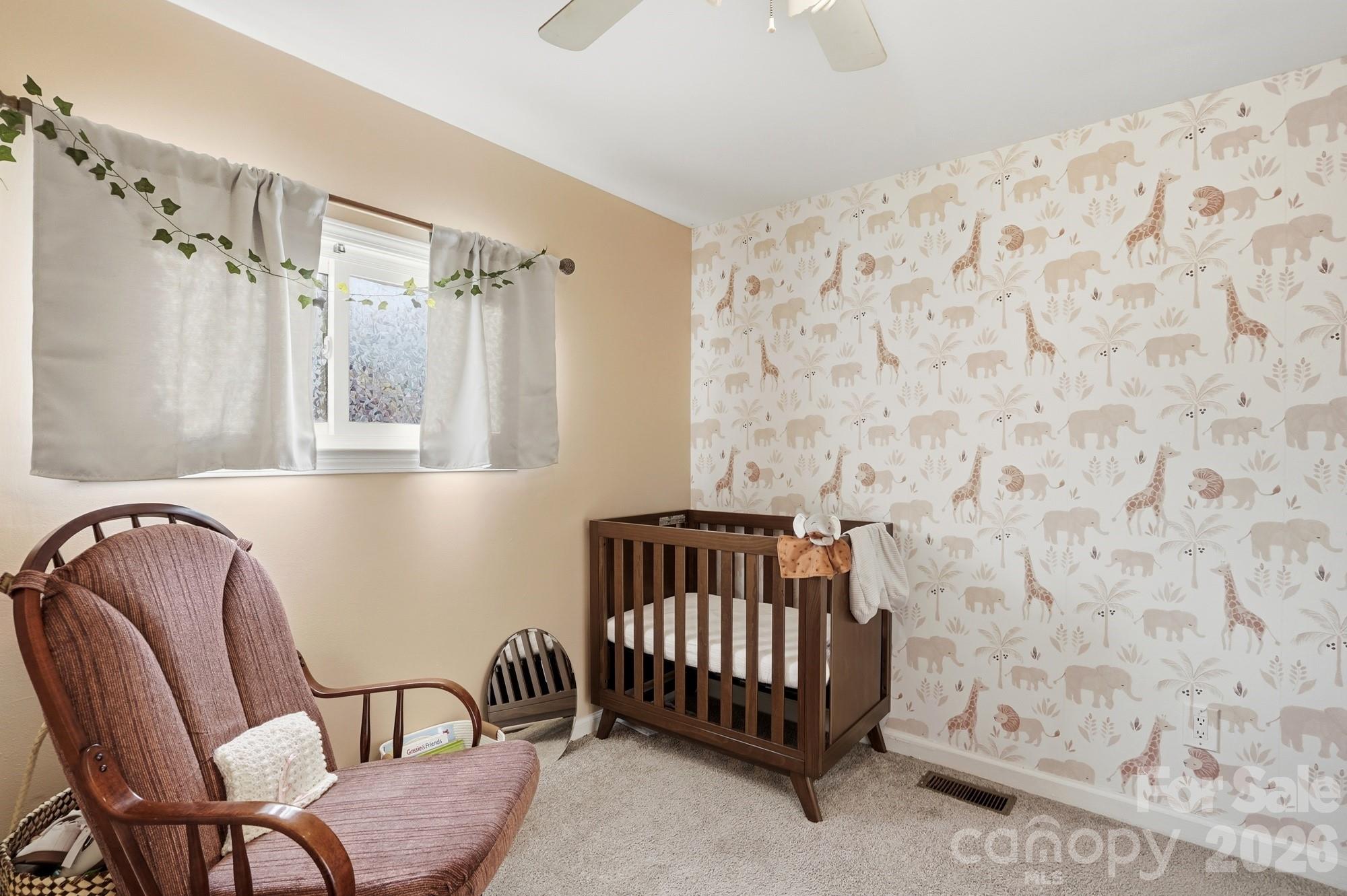 211 Ratchford Farm Road Gastonia, NC 28056 - Photo 19 of 24 a bedroom with a bed and a chair