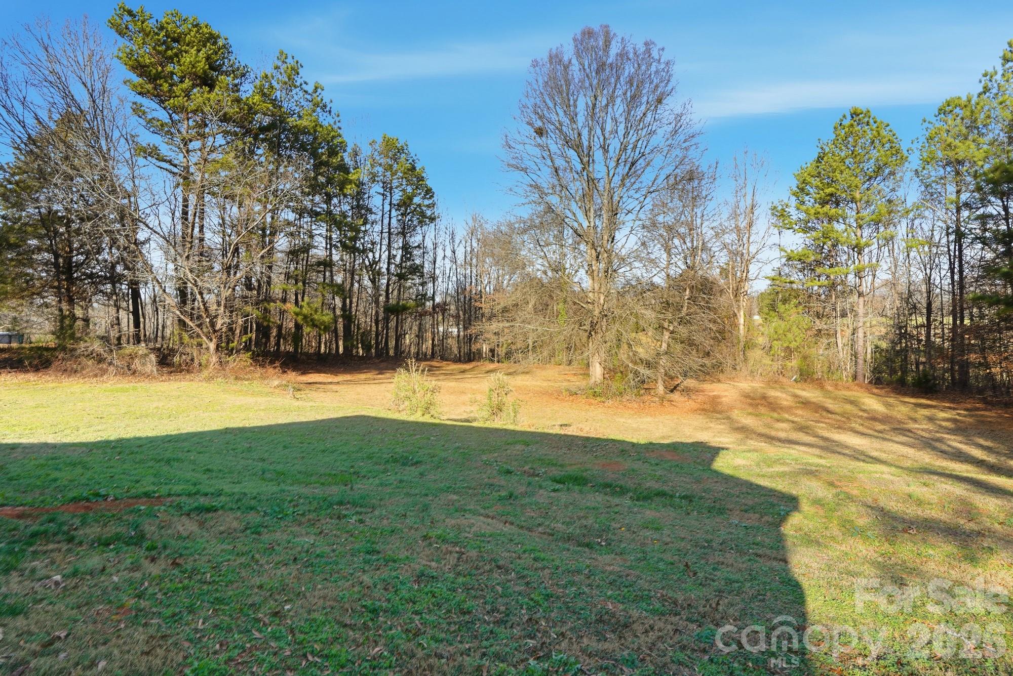 211 Ratchford Farm Road Gastonia, NC 28056 - Photo 21 of 24 a view of yard with swimming pool and trees