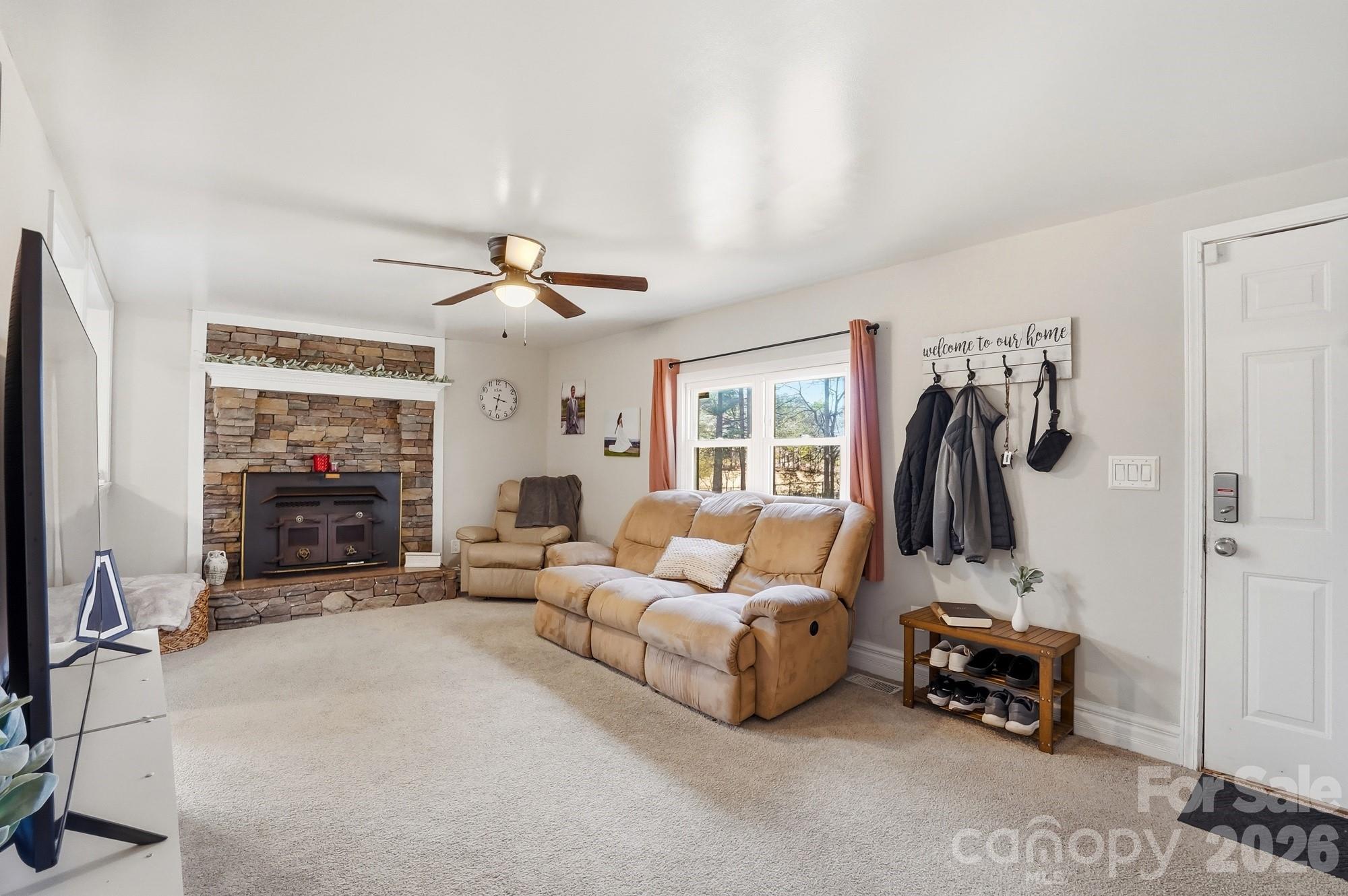 211 Ratchford Farm Road Gastonia, NC 28056 - Photo 3 of 24 a living room with furniture and a flat screen tv