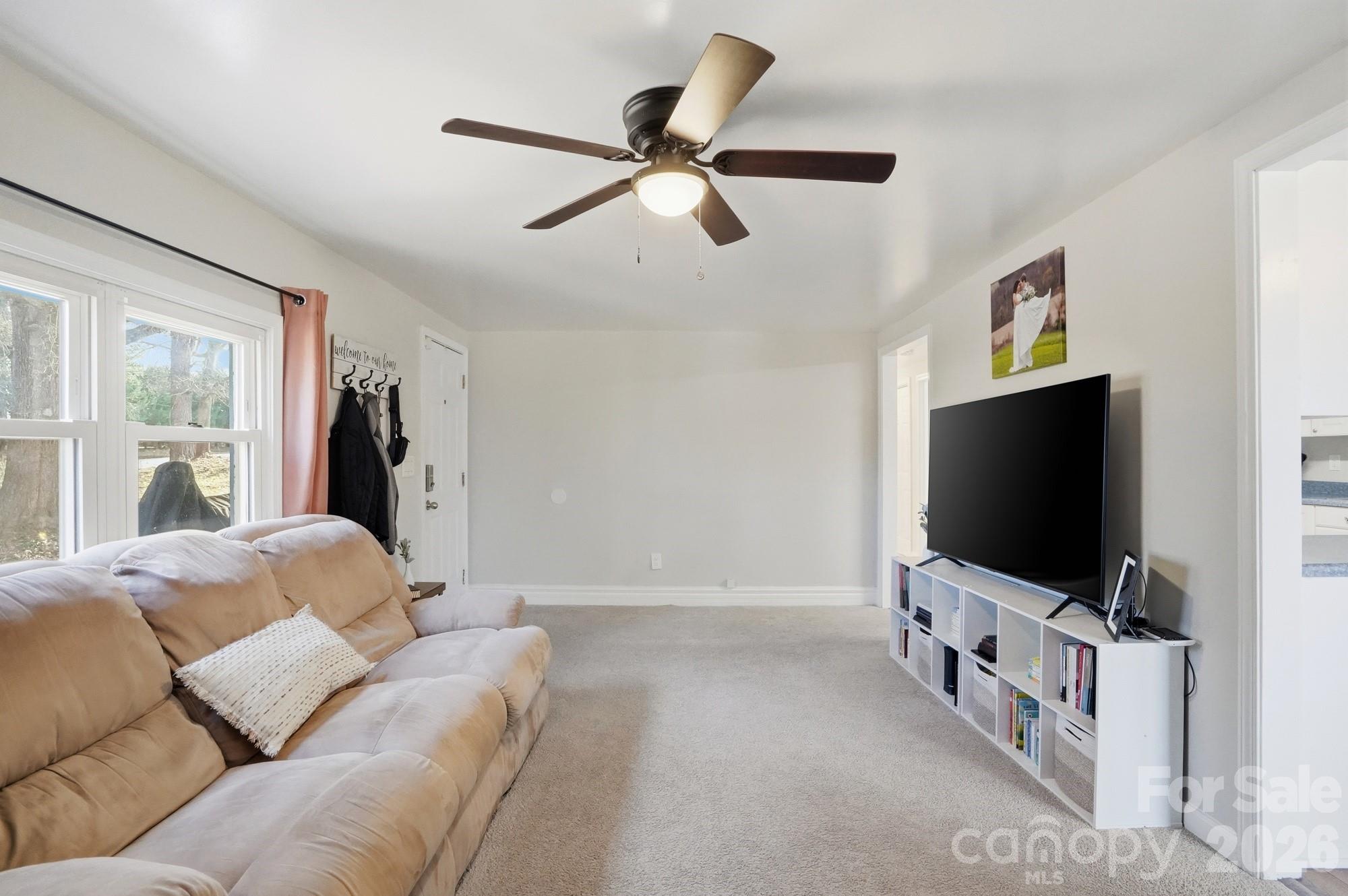211 Ratchford Farm Road Gastonia, NC 28056 - Photo 4 of 24 a living room with furniture and a flat screen tv