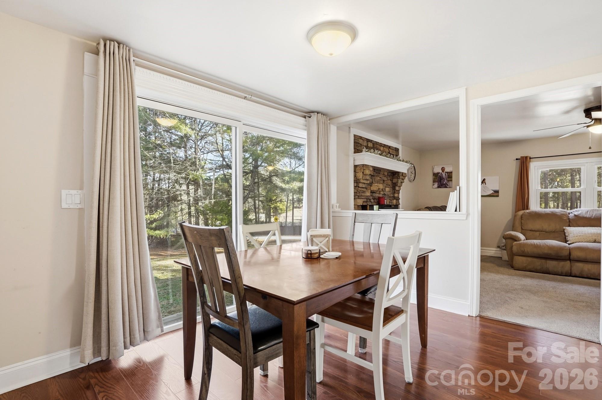 211 Ratchford Farm Road Gastonia, NC 28056 - Photo 5 of 24 a view of a dining room with furniture window and wooden floor