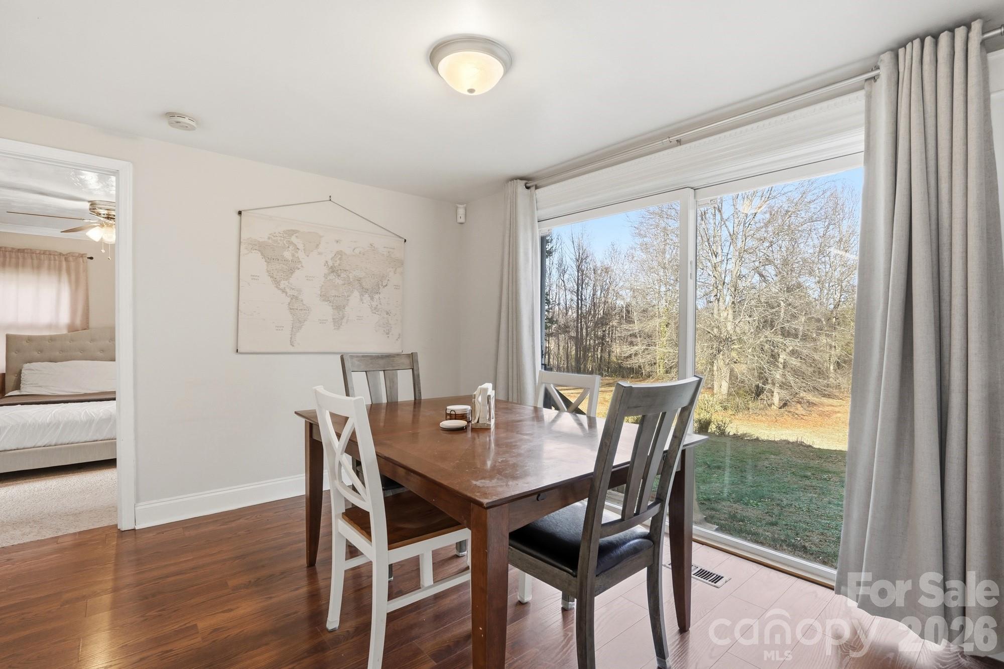 211 Ratchford Farm Road Gastonia, NC 28056 - Photo 6 of 24 a view of a dining room with furniture window and wooden floor