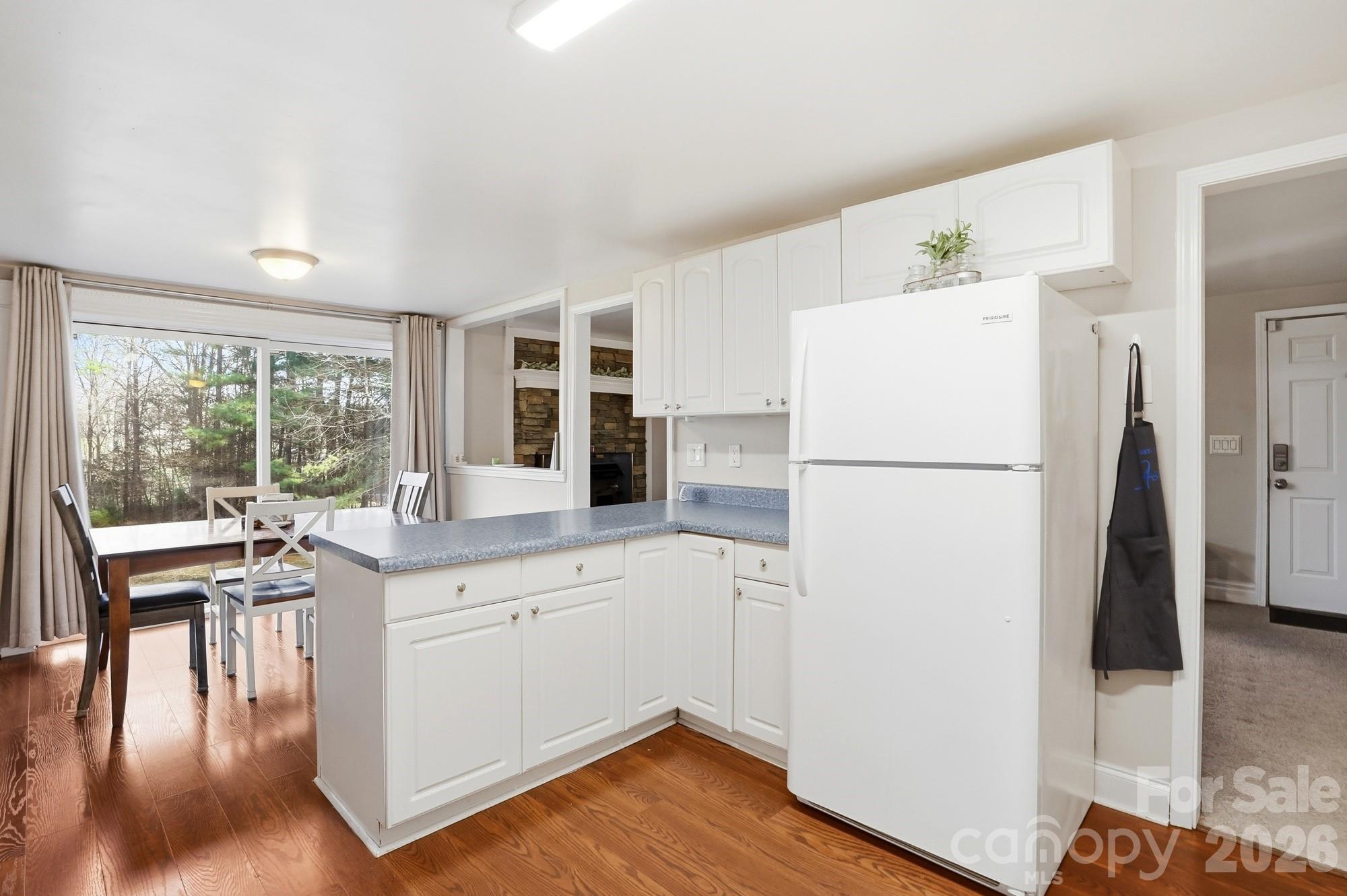 211 Ratchford Farm Road Gastonia, NC 28056 - Photo 9 of 24 a kitchen with a refrigerator a sink and a stove top oven
