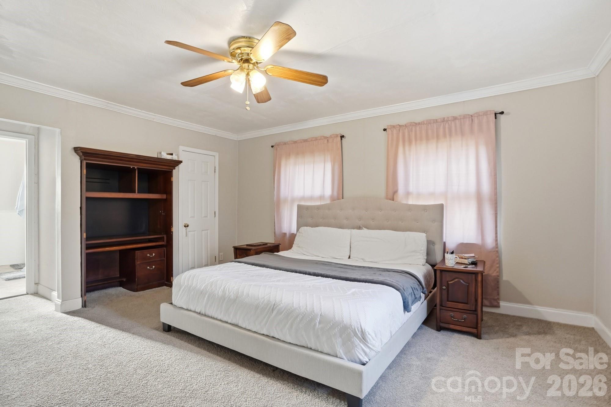 211 Ratchford Farm Road Gastonia, NC 28056 - Photo 10 of 24 a bedroom with a bed and a chandelier