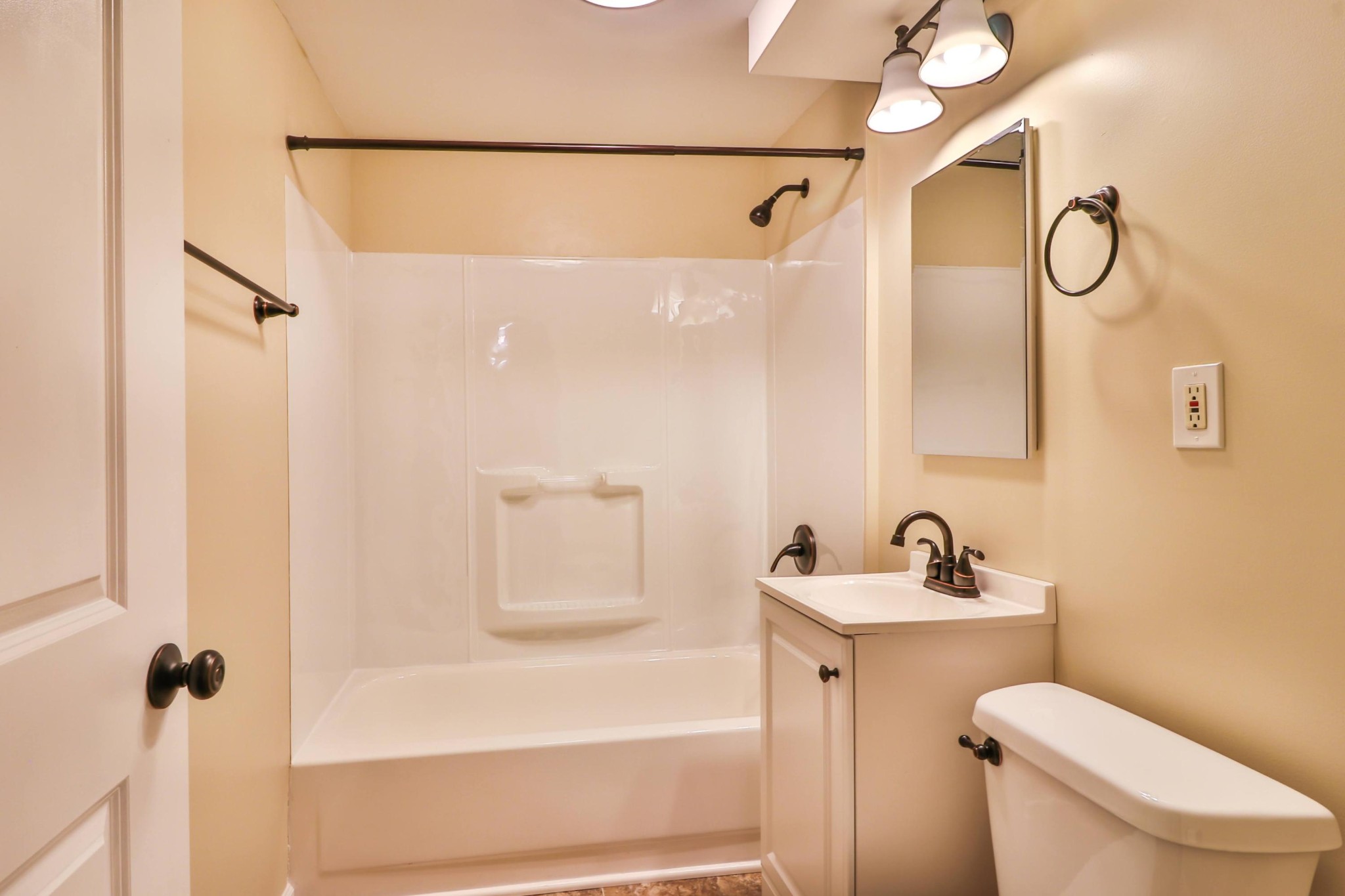 2212 Roundtree Road Knoxville, TN 37923 - Photo 18 of 27 a bathroom with a sink a toilet and shower
