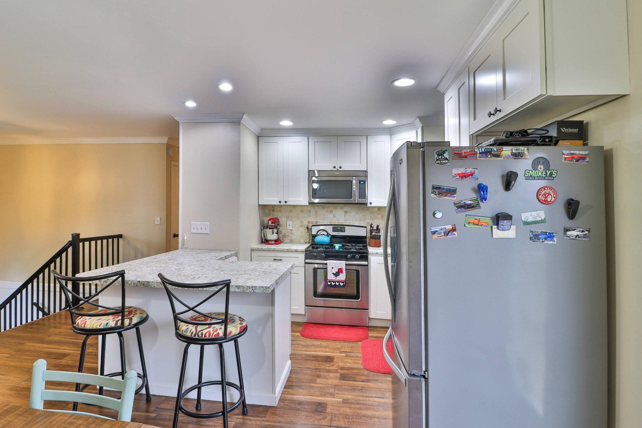 2212 Roundtree Road Knoxville, TN 37923 - Photo 7 of 27 a kitchen with stainless steel appliances a refrigerator and a stove