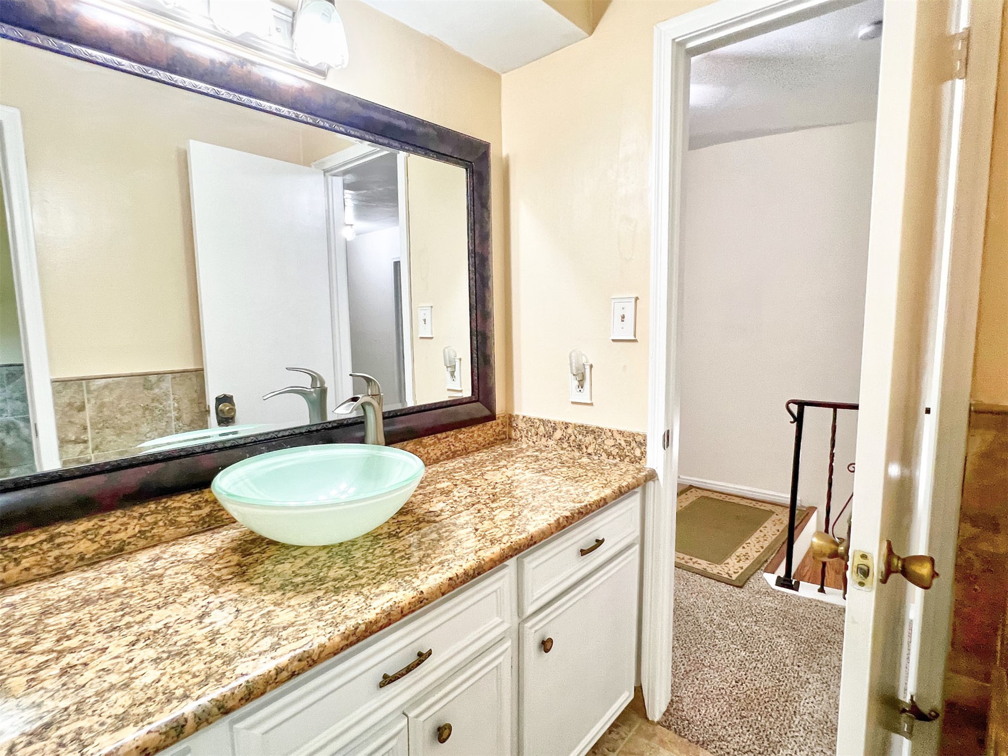 16902 Summit Oaks Lane Spring, TX 77379 - Photo 37 of 49 a bathroom with a granite countertop sink and a mirror
