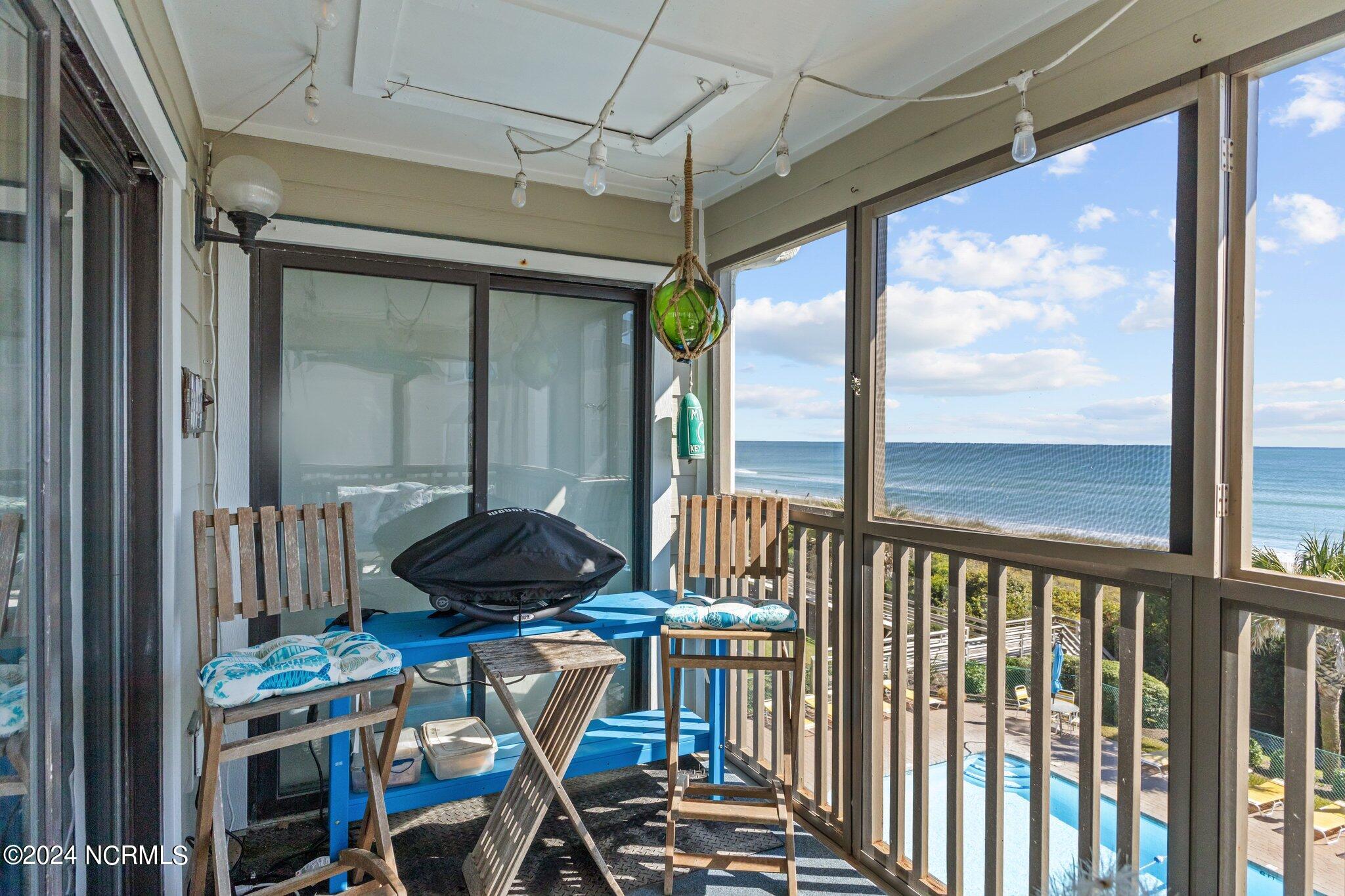 497 Salter Path Road, Unit B22 Pine Knoll Shores, NC 28512 - Photo 12 of 36 Screened in patio
