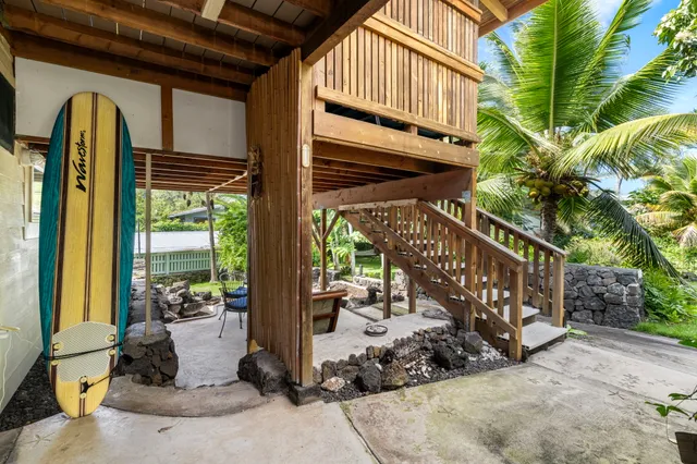 a view of a porch with potted plants