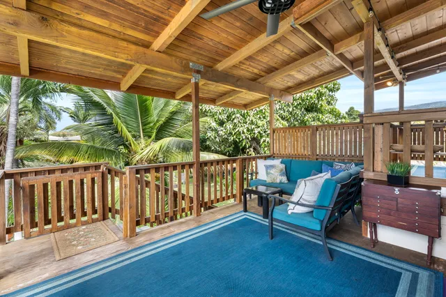 a view of a two chairs in the patio