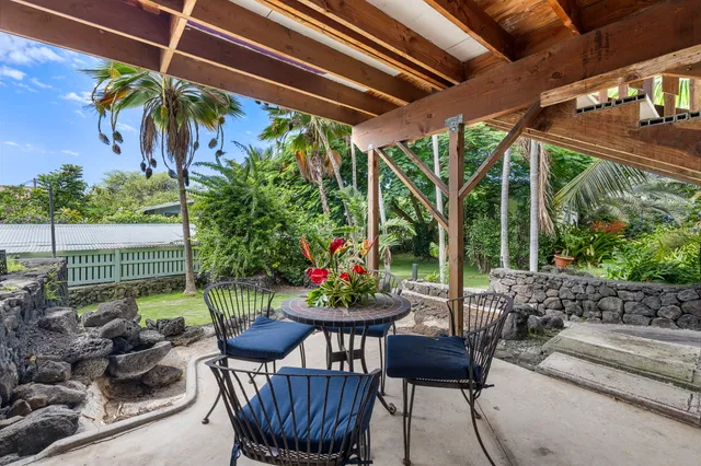 a view of an chairs and table in patio