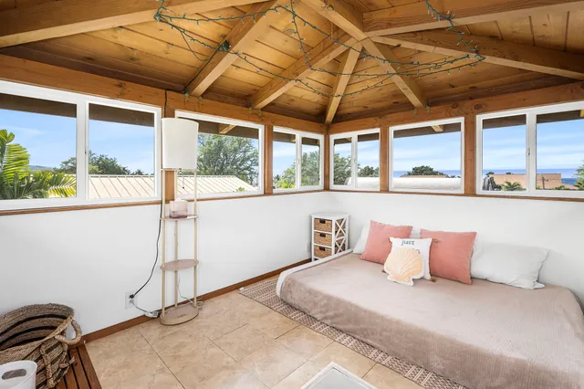a bedroom with furniture and a window