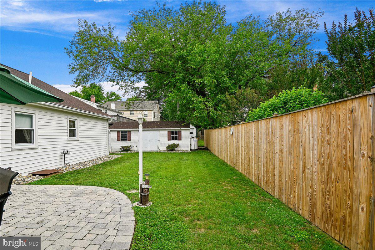 1731 Tacoma Road Edgewater, MD 21037 - Photo 10 of 59 Lush green yard with wooden fence.