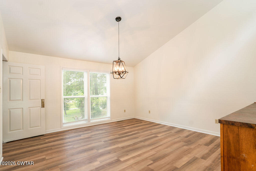 7 Timberlake Drive Jackson, TN 38305 - Photo 2 of 38 a view of empty room with wooden floor and fan
