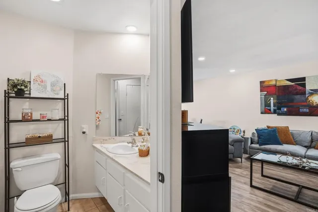 a en suite bathroom with a toilet sink and mirror