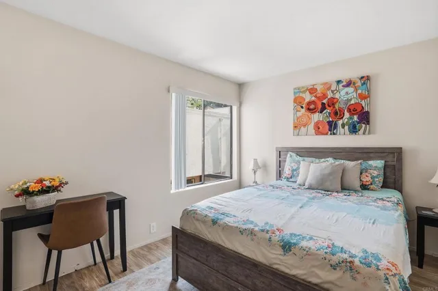 a bedroom with a bed and a chair