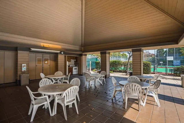a view of a dining room with furniture wooden floor and chandelier