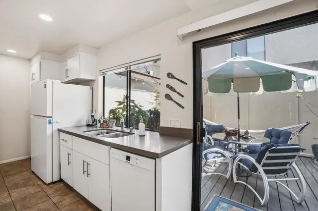 a kitchen with stainless steel appliances granite countertop a sink and cabinets