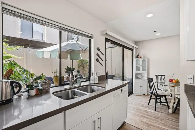 a kitchen with sink and window