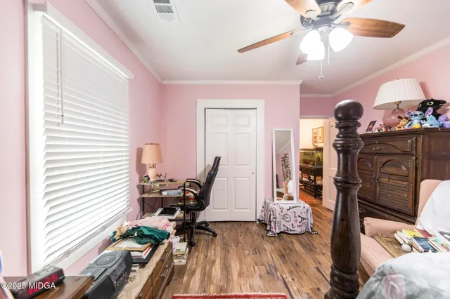 a view of a livingroom with furniture and a window