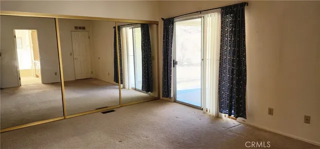 an empty room with sliding door