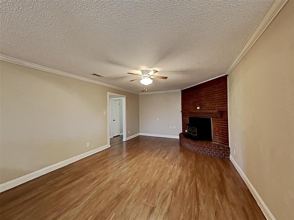 2330 Farm To Market Road 1387 Midlothian, TX 76065 - Photo 2 of 17 a view of an empty room with wooden floor
