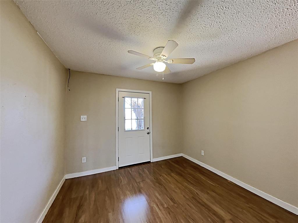 2330 Farm To Market Road 1387 Midlothian, TX 76065 - Photo 6 of 17 an empty room with a window and a ceiling fan