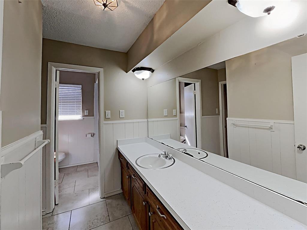 2330 Farm To Market Road 1387 Midlothian, TX 76065 - Photo 7 of 17 a bathroom with a sink and a mirror